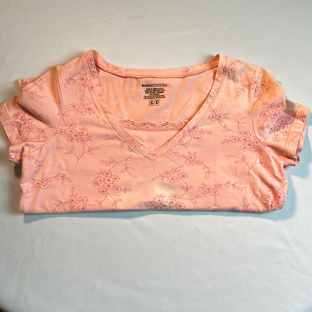 Short sleeved, pink size small T-shirt with a V-neck and Krystal embellishments